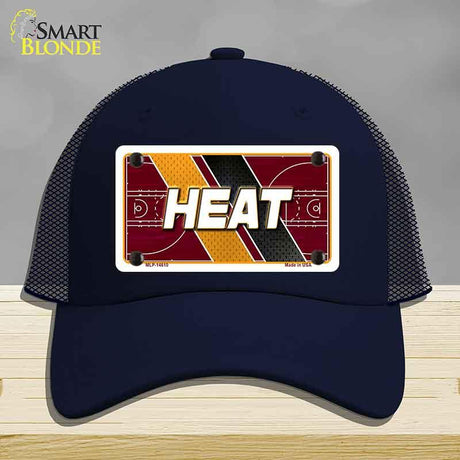 Navy blue cap with 'HEAT' design on a gray background