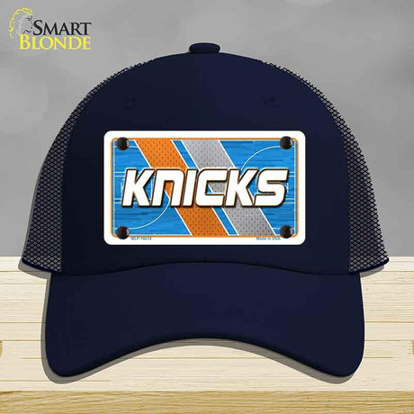 Navy blue cap with 'Knicks' logo on a gray background
