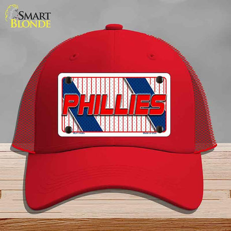 Red cap with 'Phillies' logo on a gray background