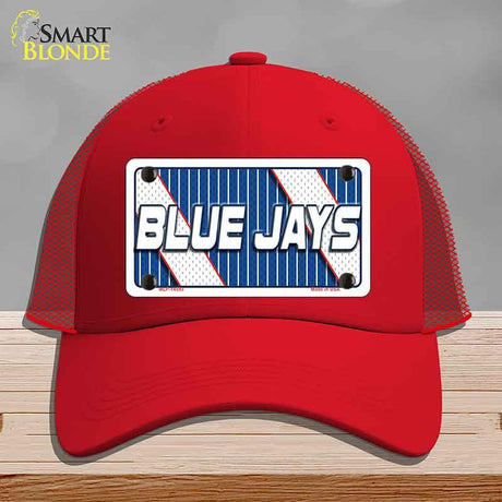 Red cap with 'Blue Jays' logo on a gray background