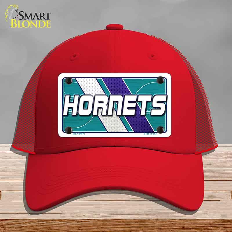 Red cap with 'Hornets' logo on a gray background