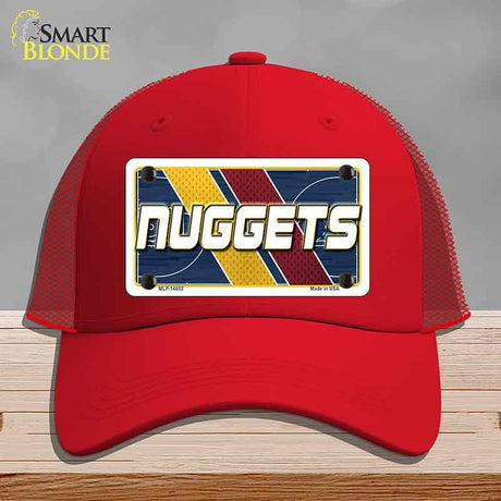 Red cap with 'NUGGETS' design on a gray background