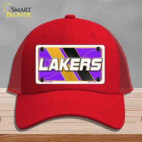Red cap with Lakers logo on a gray background