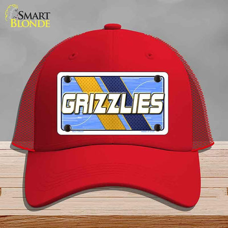 Red cap with 'GRIZZLIES' logo on a gray background
