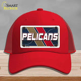 Red cap with 'Pelicans' logo on a gray background