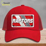 Red cap with 'RAPTORS' logo on a gray background