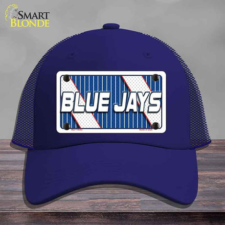 Blue cap with 'Blue Jays' logo on a wooden surface