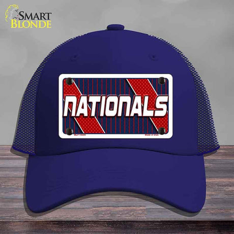 Blue cap with 'NATIONALS' design on a wooden surface