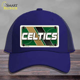Blue cap with Celtics logo on a wooden surface