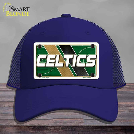Blue cap with Celtics logo on a wooden surface