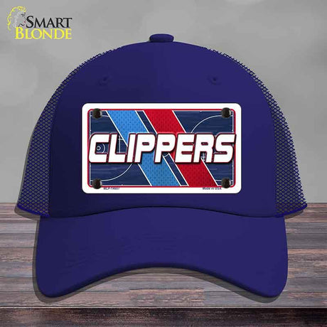 Blue cap with 'CLIPPERS' logo on a wooden surface