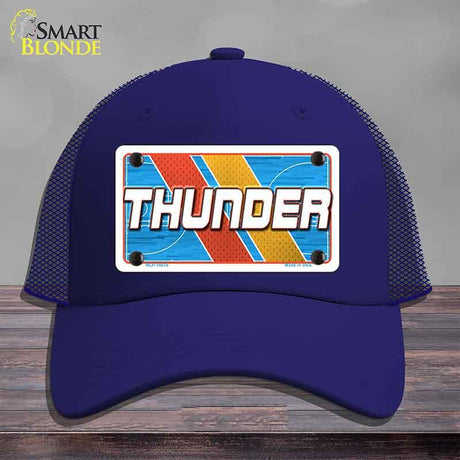 Blue cap with 'THUNDER' design on a gray background