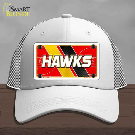 White cap with a red and yellow 'HAWKS' license plate design on a gray background