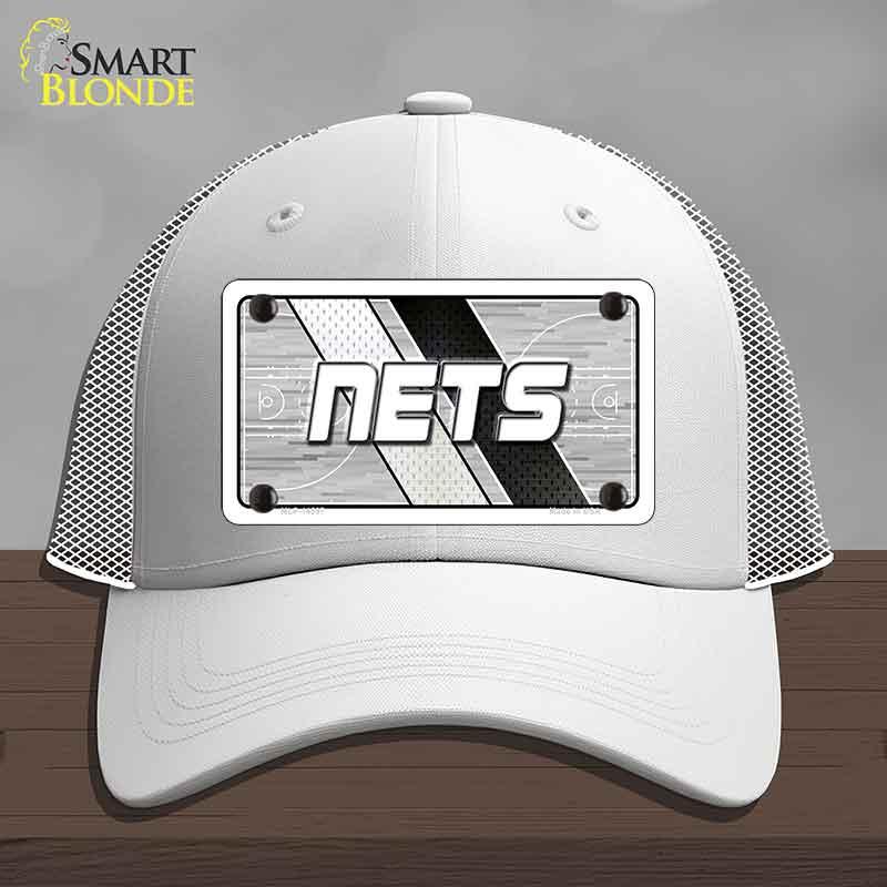 White cap with 'NETS' logo on a gray background