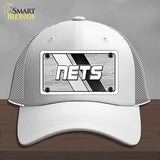 White cap with 'NETS' logo on a gray background