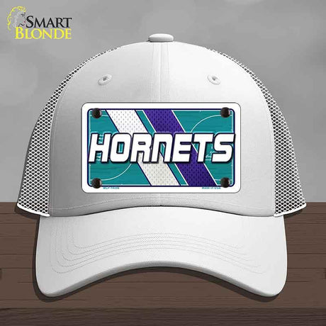 White cap with 'Hornets' design on a gray background