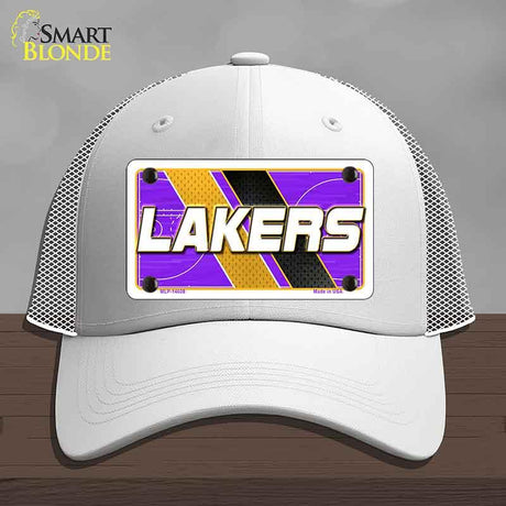 White cap with Lakers logo on a gray background