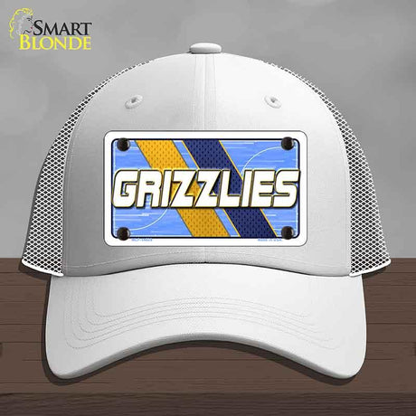 White cap with 'GRIZZLIES' license plate design on a gray background