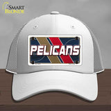White cap with 'Pelicans' logo on a gray background