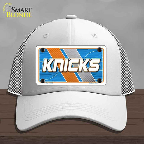 White cap with 'Knicks' design on a gray background