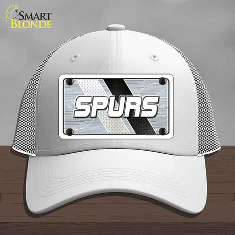 White cap with 'SPURS' logo on a gray background