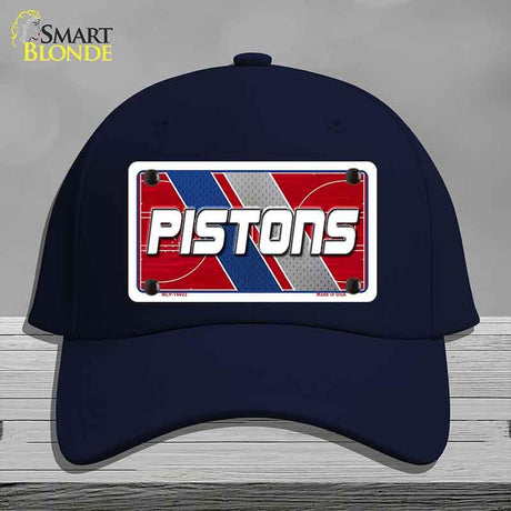 Navy blue cap with 'PISTONS' design on a gray background