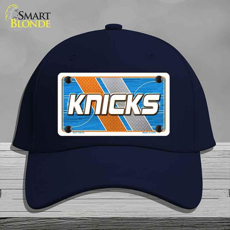 Navy blue cap with 'Knicks' logo on a gray background