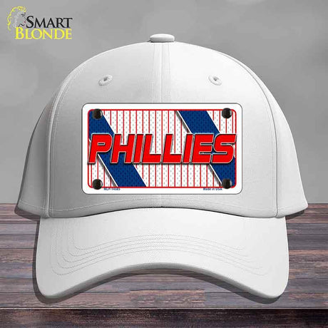 White cap with Phillies logo on a wooden surface