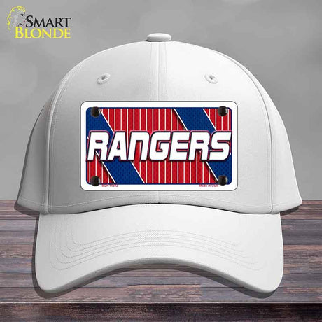 White cap with a 'Rangers' logo on a wooden surface