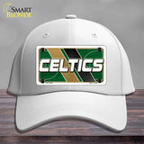 White cap with Celtics logo on a wooden surface