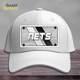 White cap with 'NETS' logo on a gray background