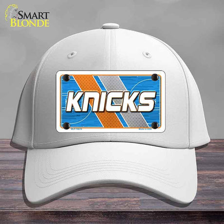 White cap with a 'Knicks' license plate design on a gray background