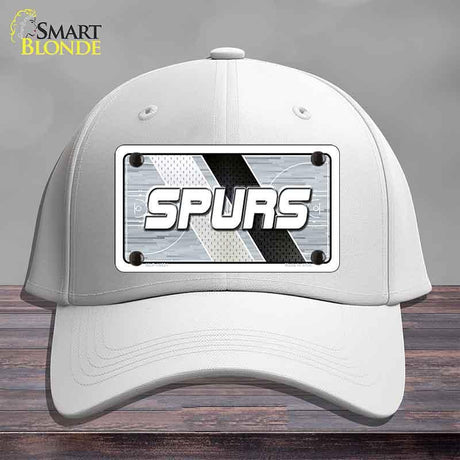 White cap with 'SPURS' logo on a gray background