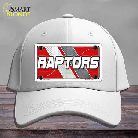 White cap with a Raptors logo on a gray background