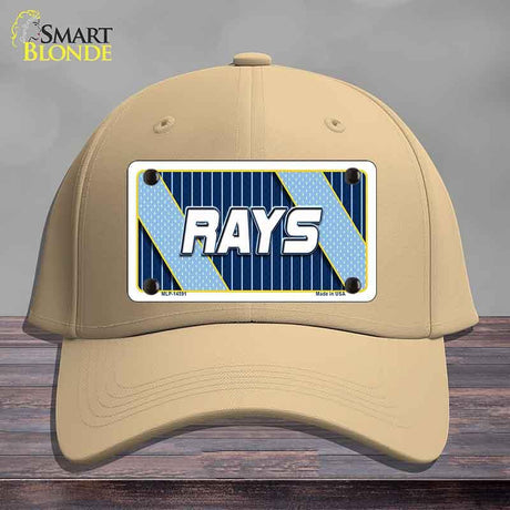 Beige cap with a 'RAYS' license plate design on a wooden surface