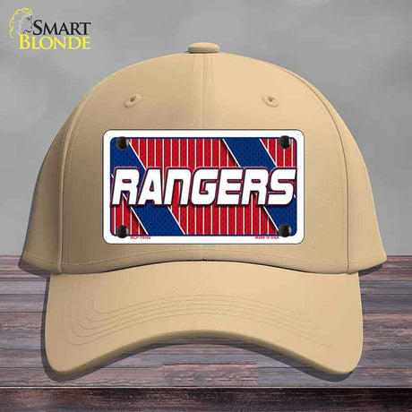 Beige cap with a 'Rangers' logo on a wooden surface
