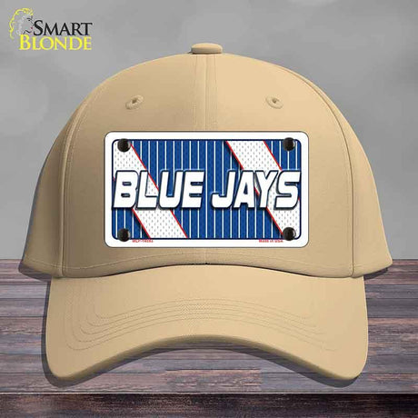 Beige cap with a 'Blue Jays' license plate design on a wooden surface