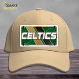 Beige cap with Celtics logo on a wooden surface