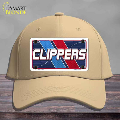 Beige cap with a 'CLIPPERS' logo on a wooden surface
