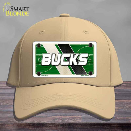 Beige cap with a 'Bucks' license plate design on a wooden surface