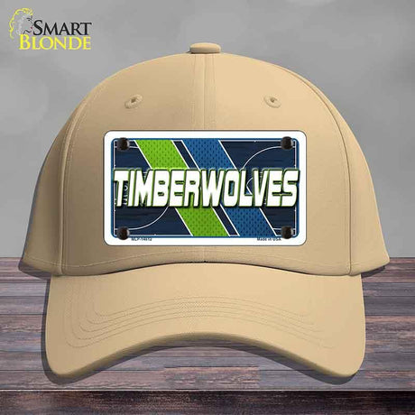 Beige cap with a 'Timberwolves' license plate design on a wooden surface.
