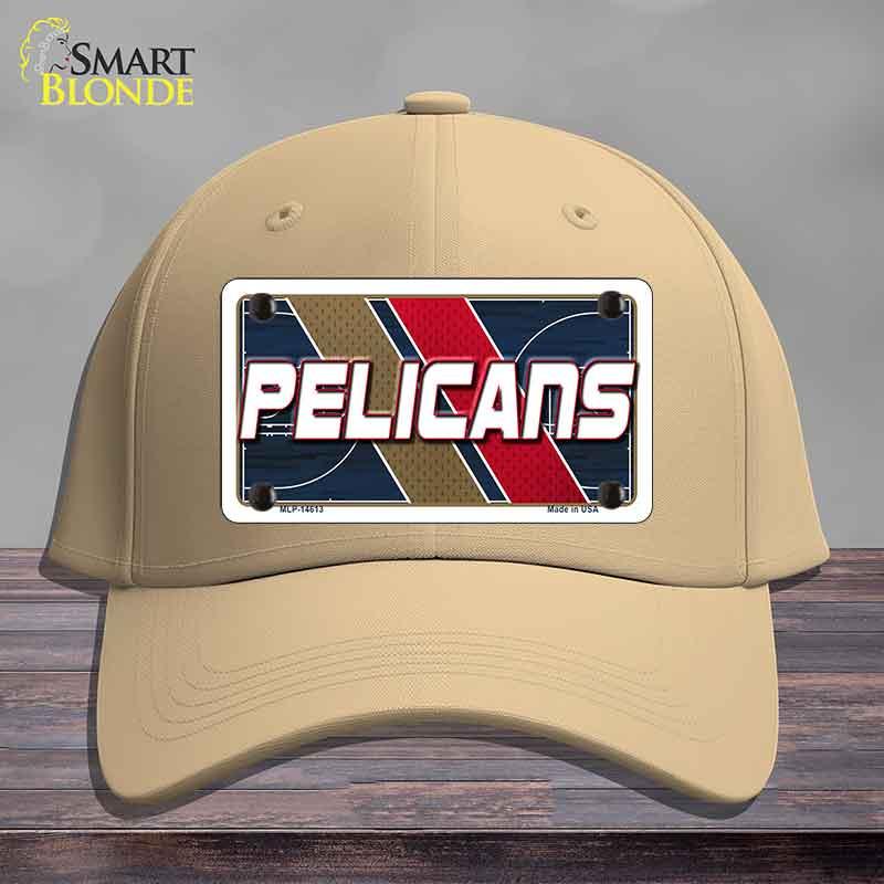 Beige cap with a 'Pelicans' license plate design on a wooden surface