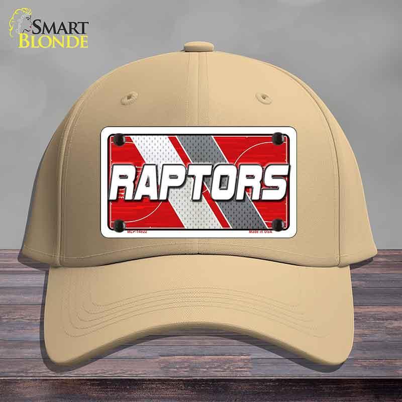 Beige cap with a 'Raptors' license plate design on a wooden surface