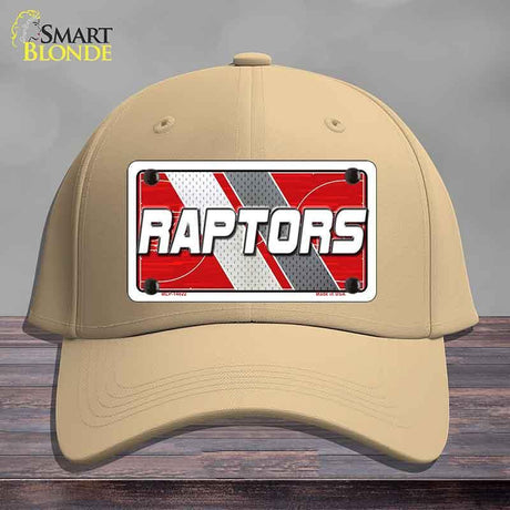 Beige cap with a 'Raptors' license plate design on a wooden surface