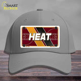 Gray cap with a 'HEAT' license plate design on a wooden surface