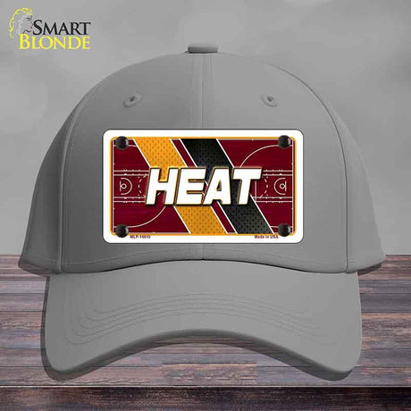 Gray cap with a 'HEAT' license plate design on a wooden surface