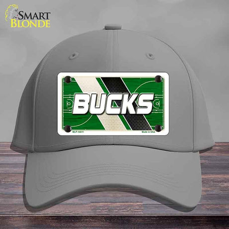 Gray cap with a 'Bucks' license plate design on a wooden surface