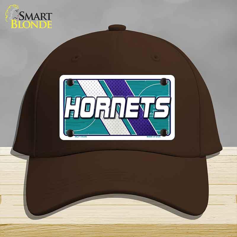 Brown cap with Hornets logo on a gray background