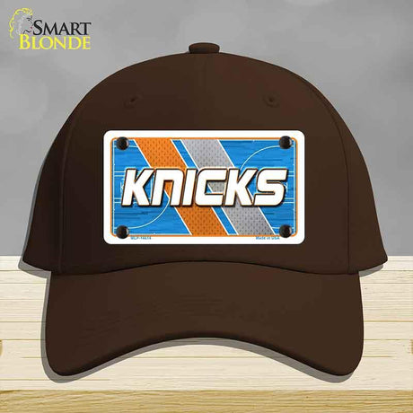 Brown cap with a 'Knicks' license plate design on a gray background