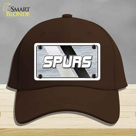 Brown cap with 'SPURS' logo on a gray background